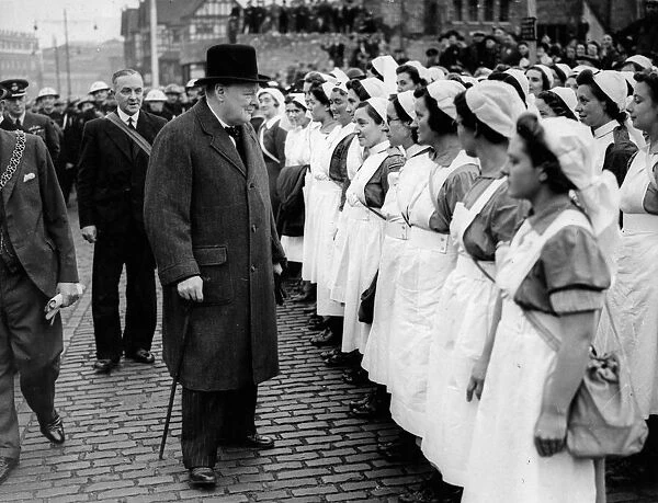 Prime Minister Winston Churchill accompanied by the Mayor and Alderman JA Mosely
