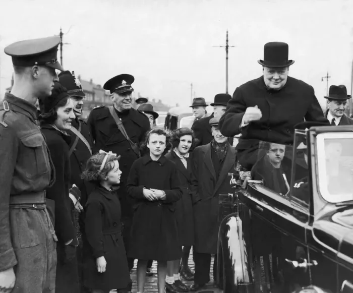 Framed Print : Prime Minister Winston Churchill sitting on the back of an open car on his surprise visit Framed Print : Prime Minister Winston Churchill sitting on the back of an open car on his surprise visit