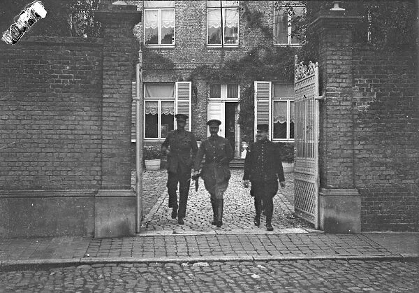 Prince Alexander of Teck (centre) leaving his quarters at the front in the company of a