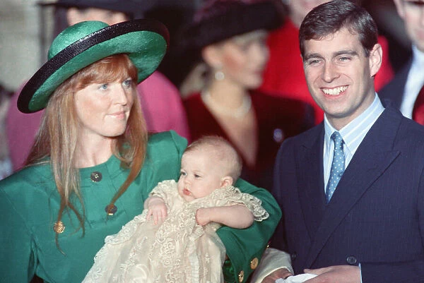 Prince Andrew at the Christening of his daughter Princess Beatrice who is being held by