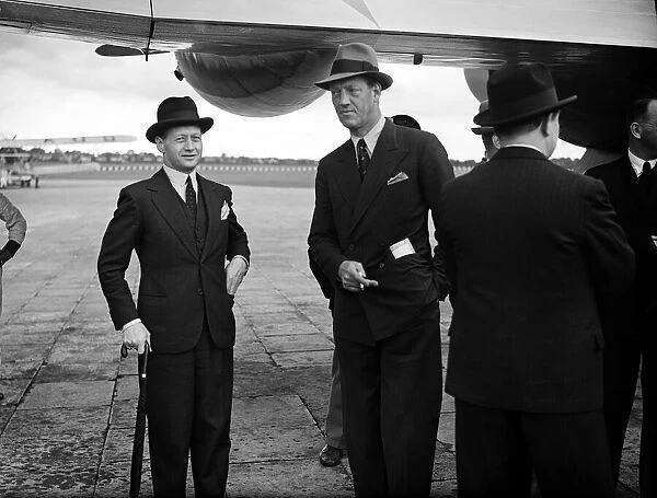 Prince Axel of Denmark (centre) on a official visit dis-embarks from Danish Air Lines