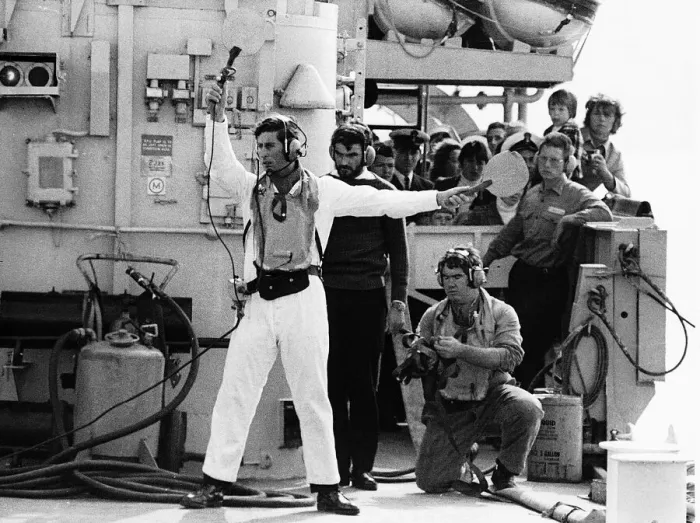 Framed Print : Prince Charles acting as batman to guide the helicopter of HMS Jupiter flight deck Framed Print : Prince Charles acting as batman to guide the helicopter of HMS Jupiter flight deck