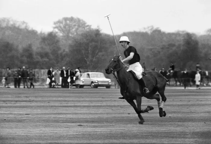 Framed Print : Prince Charles in action during his first polo game at Windsor Park alongside his father