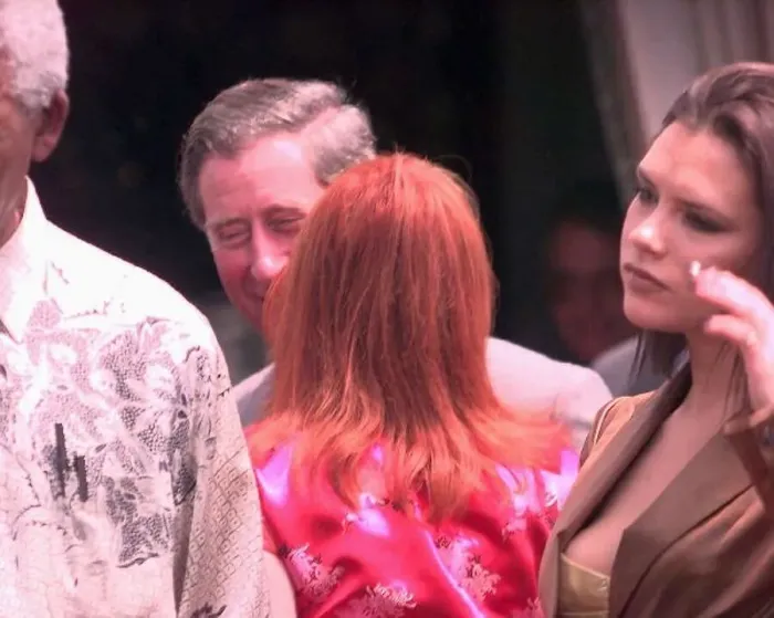  : Prince Charles gets a kiss from Geri Halliwell outside President Nelson Mandelas house in