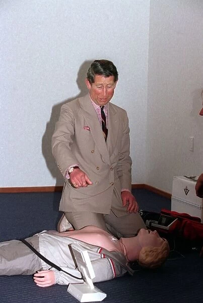 Prince Charles getting up close and personal with a rescussitation dummy at