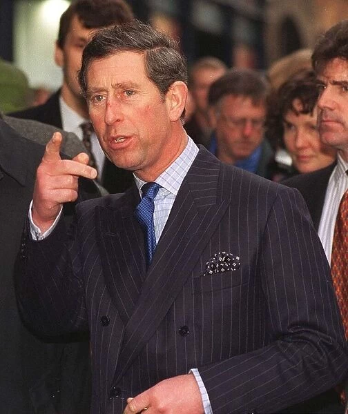 Prince Charles pointing right finger as he enters the Tron Church in Edinburgh