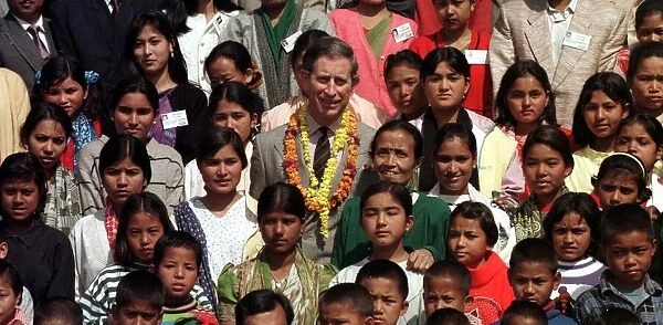 Prince Charles poses with young Nepalese children February 1998 Following his