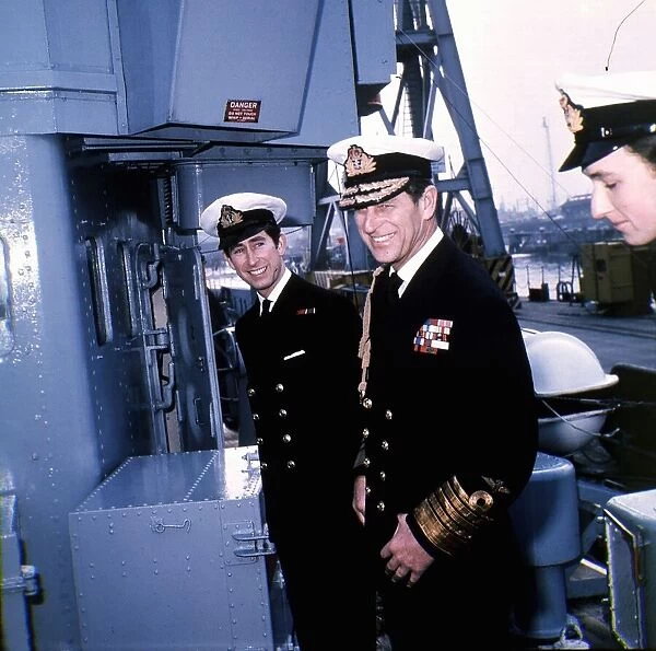 Prince Charles and Prince Philip wearing naval uniform aboard HMS Bonnington
