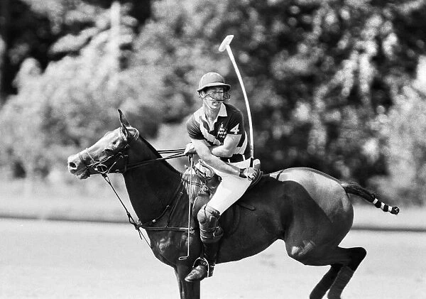 Prince Charles, the Prince of Wales in action for his polo team '