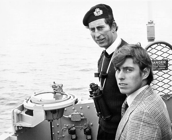 Prince Charles, The Prince of Wales on board HMS Bronington showing his younger brother