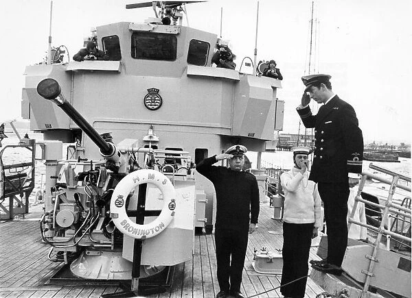 Prince Charles, The Prince of Wales on board HMS Bronington - he salutes as he is piped