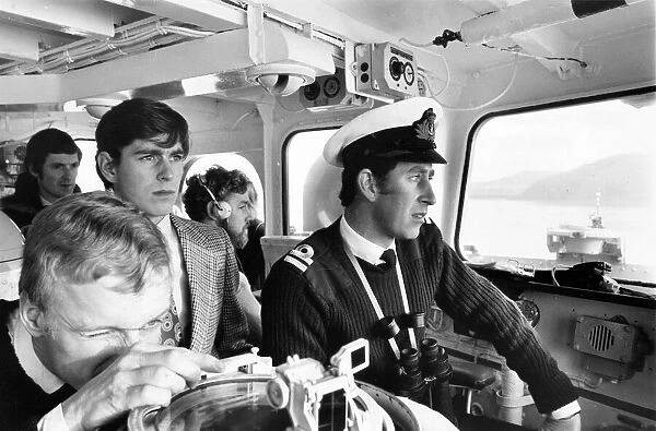 Prince Charles, The Prince of Wales on board HMS Bronington showing his younger brother