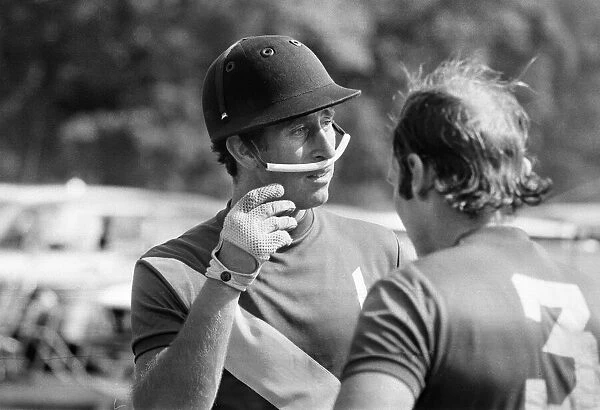 Prince Charles, the Prince of Wales pictured with a teammate after taking part in a polo
