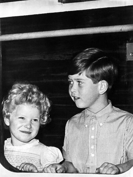 Prince Charles - The Prince of Wales with his sister Princess Anne at the door of a