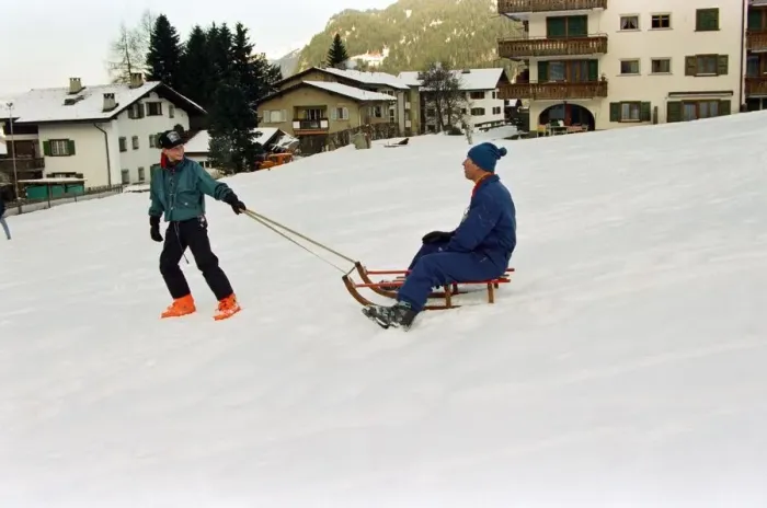 Framed Print : Prince Charles is pulled on a sledge by Prince Harry while on holiday in Klosters