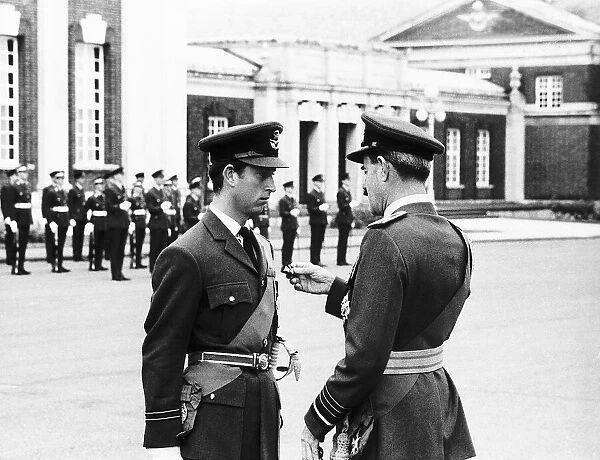 Prince Charles receiving his pilots wings from Air Chief Marshal Sir Denis Spotswood at