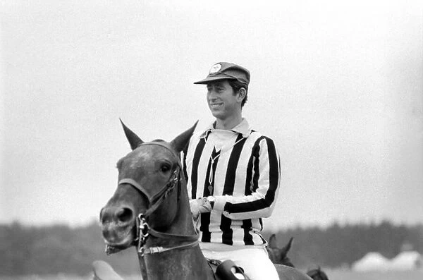 Prince Charles referees at polo today, Windsor Park. He is wearing a striped shirt