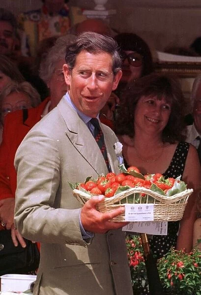Prince Charles at Sandringham holding a basket of strawberries, July 1996