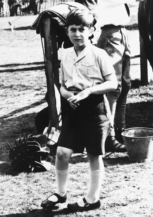 Framed Print : Prince Charles as a shy young boy wearing knee lengths shorts nervously playing with his