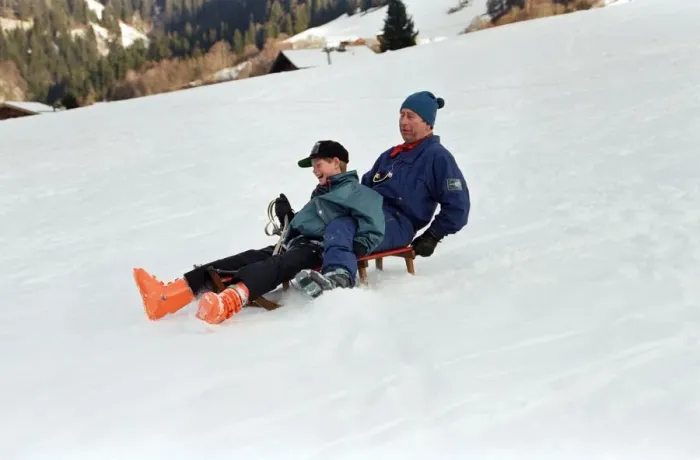 Framed Print : Prince Charles on a sledge with Prince Harry while on holiday in Klosters, Switzerland