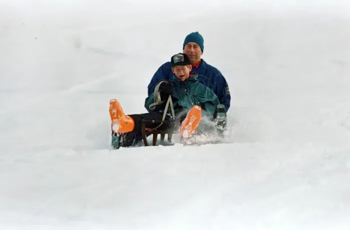 Framed Print : Prince Charles on a sledge with Prince Harry while on holiday in Klosters, Switzerland