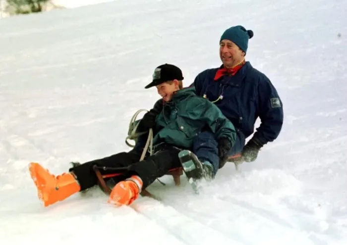 Framed Print : Prince Charles on a sledge with Prince Harry while on holiday in Klosters Switzerland