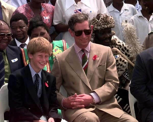Prince Charles and his son Prince Harry, November 1997 Watching topless Zulu dancers in