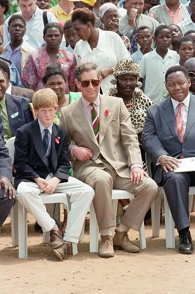 Prince Charles and his son Prince Harry visit the village of Dukuduku in South Africa