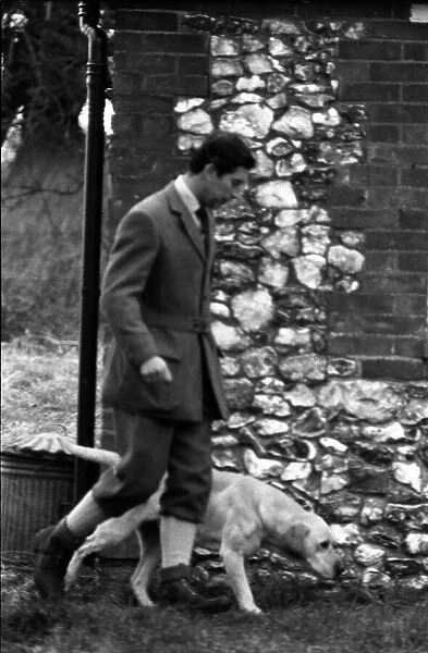Prince Charles walks a dog at the Sandringham Shooting January 1981