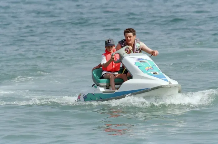 Framed Print : Prince Harry on a jet ski while on holiday in Marbella, Spain, July 1994 Framed Print : Prince Harry on a jet ski while on holiday in Marbella, Spain, July 1994