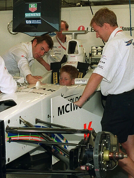 Prince Harry with Paul Stewart in the Stewart July 1999 Ford car at the British Grand