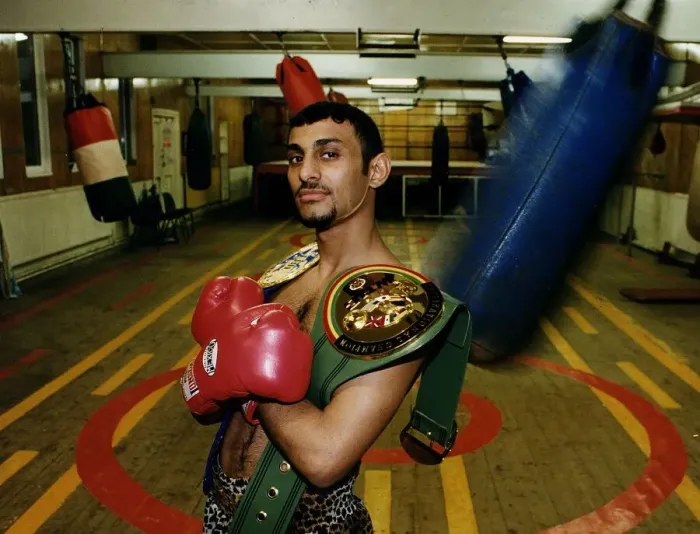 Framed Print : Prince Naseem Hamed in Sheffield gym with the WBC & IBO title belts looking smug proud