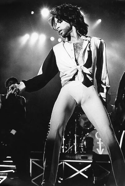 Prince performing on stage during The Nude Tour