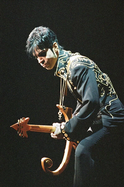 Prince performing on stage during his Ultimate Live Experience Tour