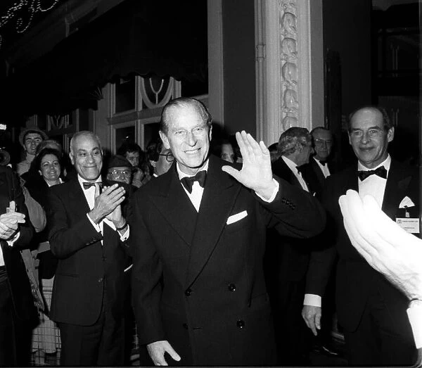 Prince Philip being applauded at an official dinner. December 1986