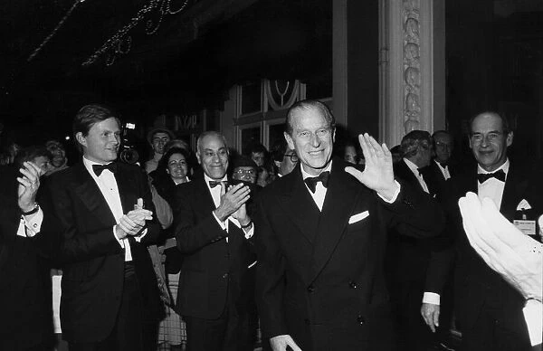 Prince Philip being applauded at an official dinner. December 1986