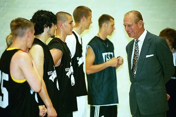 Prince Philip, Duke of Edinburgh, chats to the basketball players at the Washington