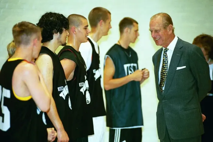 Framed Print : Prince Philip, Duke of Edinburgh, chats to the basketball players at the Washington