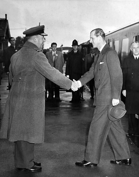 Prince Philip, the Duke of Edinburgh is greeted by Air Commodore V D Moorhead, C. O