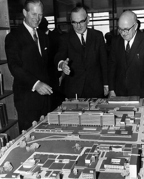 Prince Philip, the Duke of Edinburgh, looking at a model of the completed scheme at