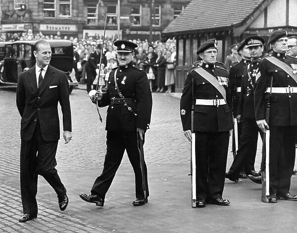 Prince Philip, the Duke of Edinburgh making a joke after inspecting the guard of honour