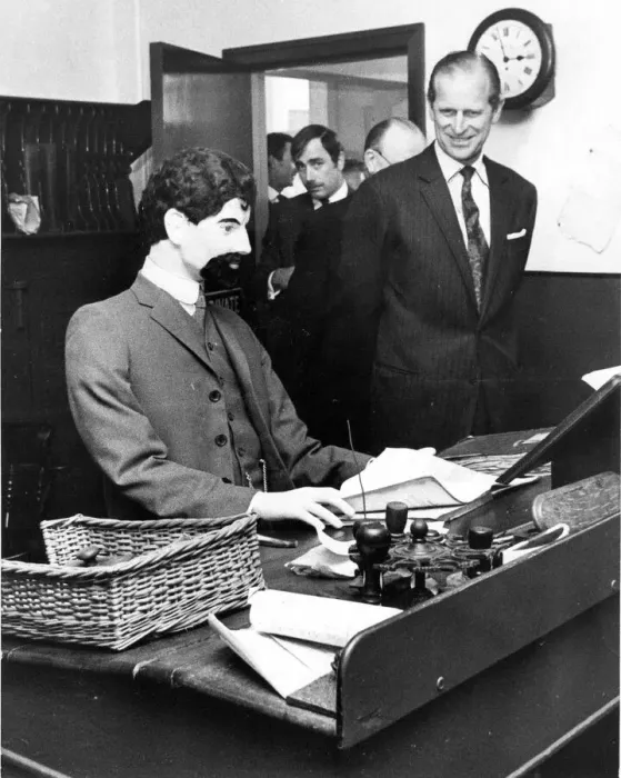 Framed Print : Prince Philip, Duke of Edinburgh, is met with a stony stare from the dummy behind Framed Print : Prince Philip, Duke of Edinburgh, is met with a stony stare from the dummy behind