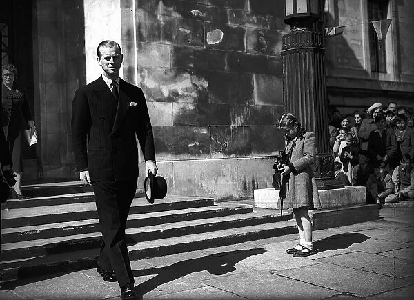 Prince Philip, Duke of Edinburgh, has his photo taken by girl as he leaves church