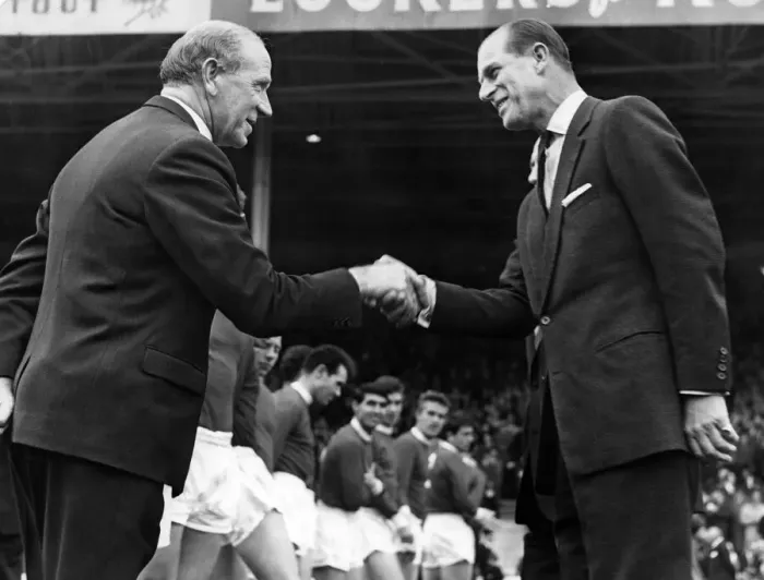 Framed Print : Prince Philip, Duke of Edinburgh shakes hands with Manchester United manager Matt Busby