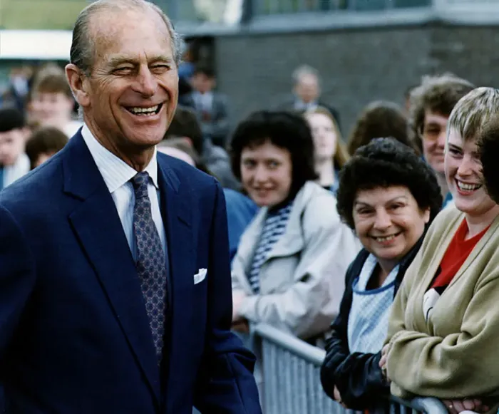 Framed Print : Prince Philip, Duke of Edinburgh, smiles as he talks to local woman on a walkabout in