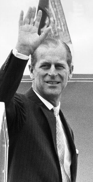 Prince Philip, Duke of Edinburgh, smiles and waves as his board the aircraft