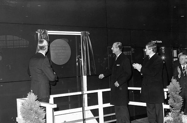 Prince Philip, Duke of Edinburgh, unveils a plaque at the new Travel Centre in