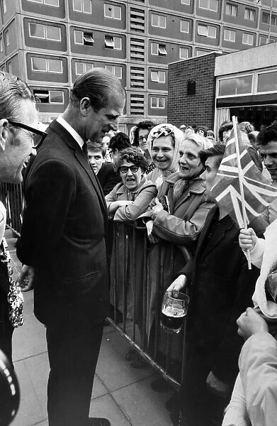 Prince Philip, Duke of Edinburgh visits Salford. Labourer David Stone, holding his pint