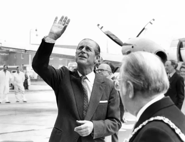 Framed Print : Prince Philip, Duke of Edinburgh waves to a party of happy school children who were Framed Print : Prince Philip, Duke of Edinburgh waves to a party of happy school children who were