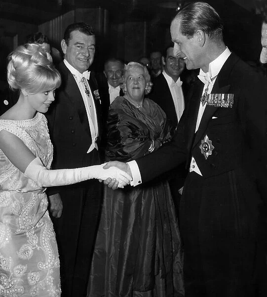 Prince Philip is introduced to Britt Ekland at the Royal Command performance of Move